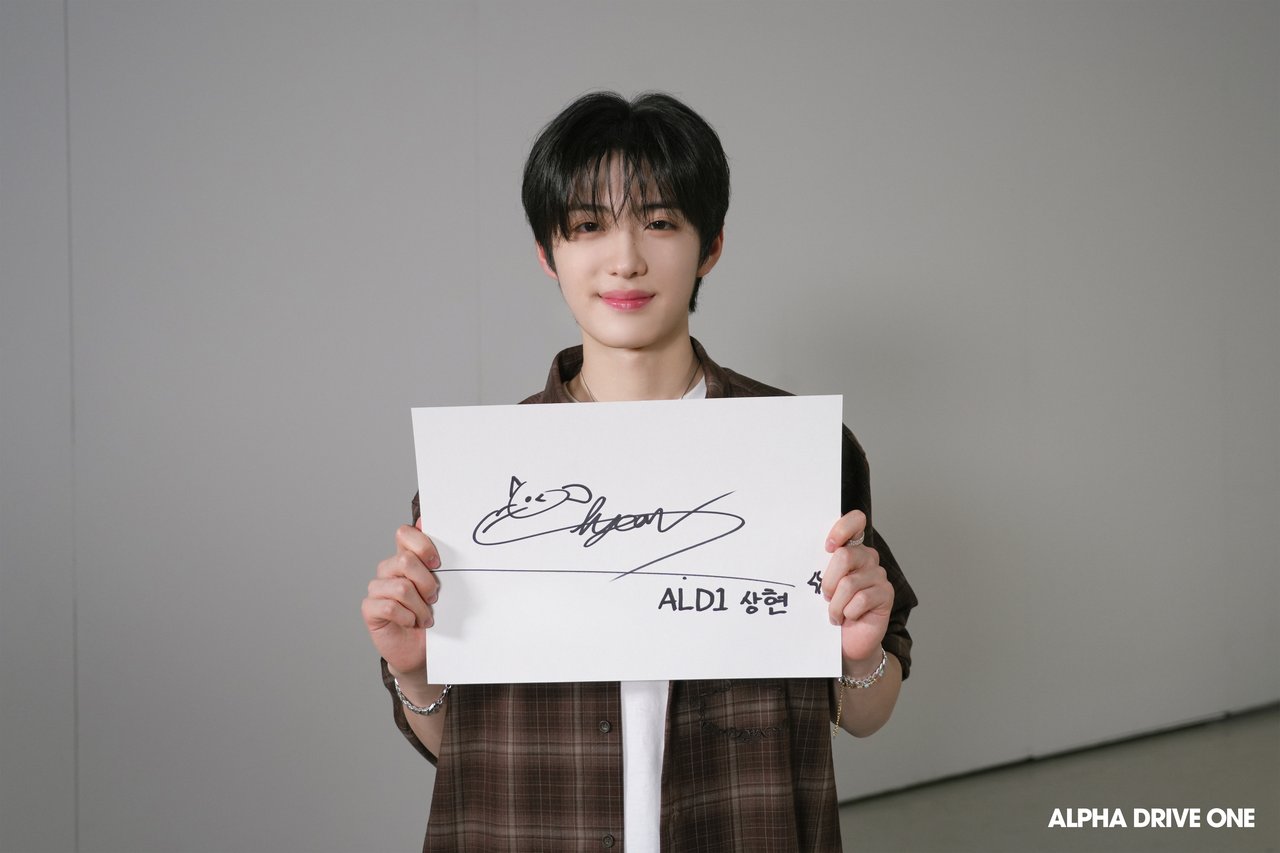 Introducing ALPHA DRIVE ONE's Signature Behind Photo