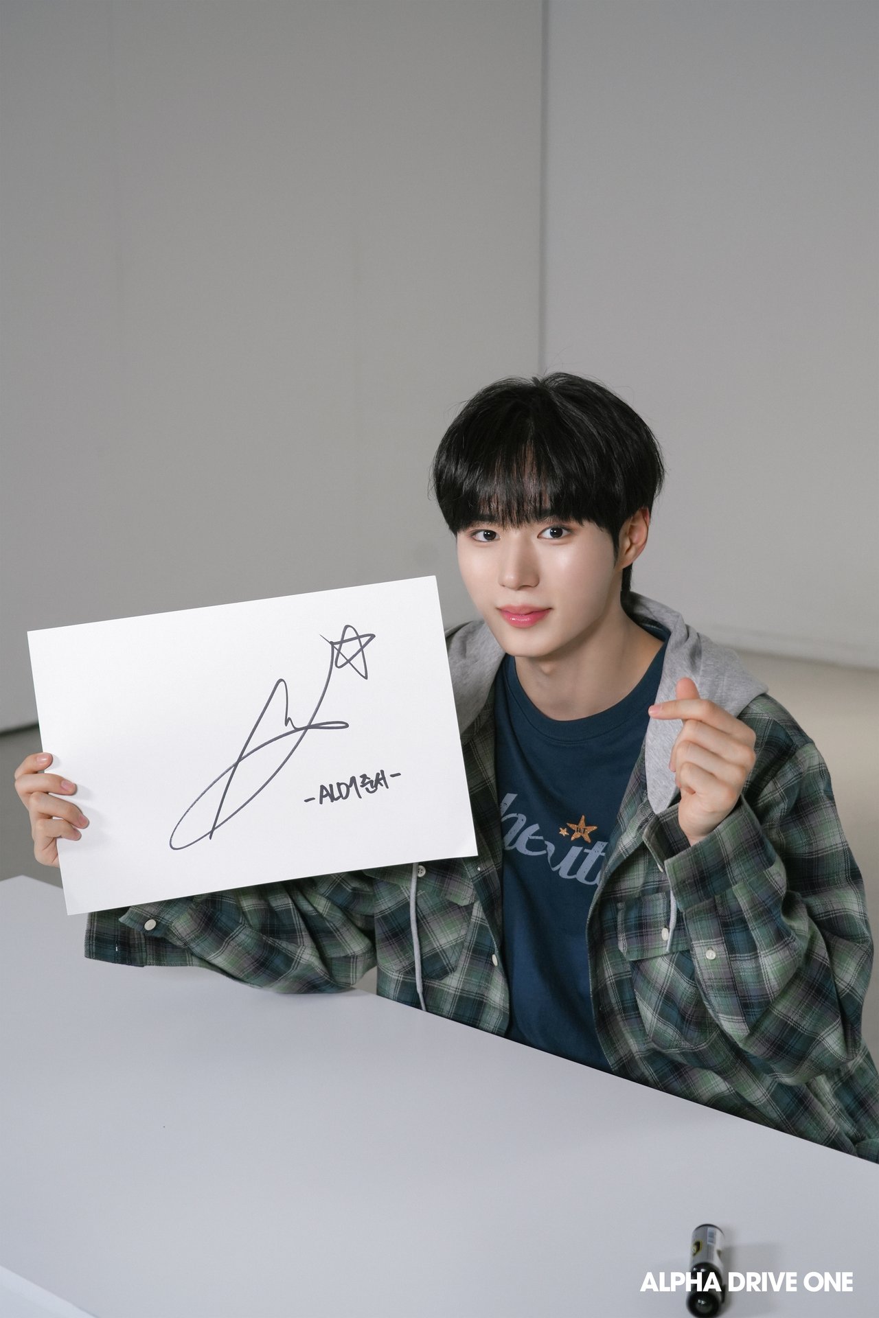 Introducing ALPHA DRIVE ONE's Signature Behind Photo