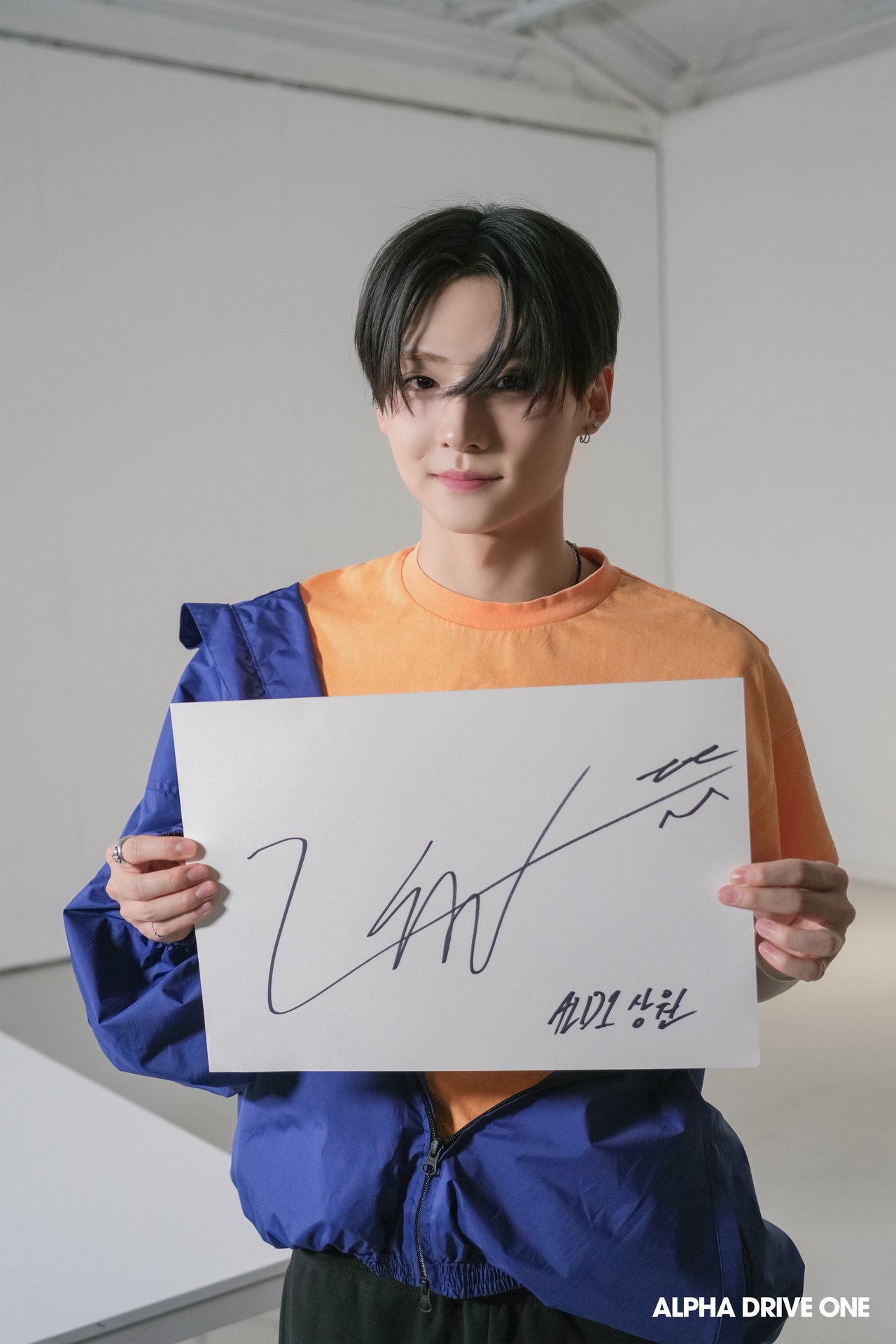 Introducing ALPHA DRIVE ONE's Signature Behind Photo